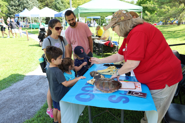 Family at table activity. Dino Day 2025